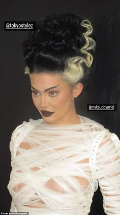 a woman with black lipstick and white dress