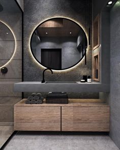 a bathroom with a sink, mirror and lights on the wall