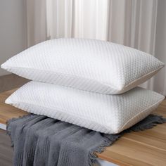 two pillows stacked on top of each other