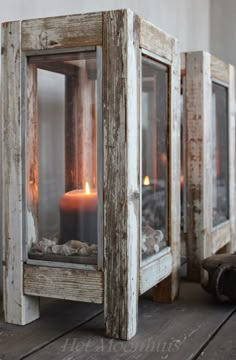 an old wooden lantern with a lit candle inside