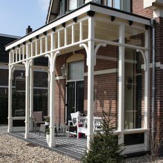 a house with a porch and covered patio