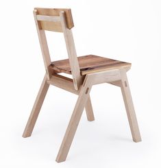 a wooden chair sitting on top of a white floor