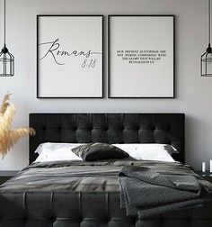 a bedroom with two pictures hanging above the bed