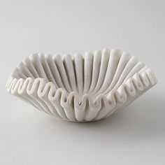 a white bowl sitting on top of a table