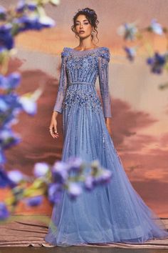 Step into a fairy tale with the exquisite azurite embellished gown. This gorgeous gown features intricate beading and delicate embellishments that give it a whimsical, romantic touch. The stunning layered glitter tulle creates an ethereal effect that will make you feel like a real-life queen. Its belted waistline adds structure to this magical dress, perfect for any dreamy or enchanted occasion. Bring your fairy tale to life in this long sleeve beauty! Andrea And Leo, Special Ocassion Dresses, Magical Dress, Look Formal, Embellished Gown, Maxi Dress Prom, فستان سهرة, Floor Length Gown, A Line Gown