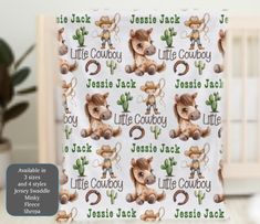 a baby crib bedding set with an image of a cow and cactus on it