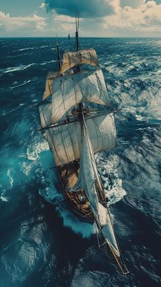 an old sailing ship in the middle of the ocean