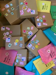 many different colored boxes with stickers on them