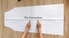 two hands pointing at a piece of paper that says the front pattern