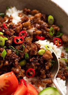 a bowl filled with rice, meat and vegetables