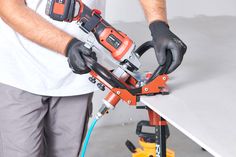 a man is working with tools on a table