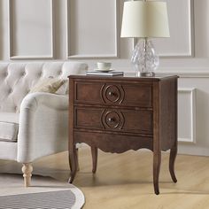 a living room scene with focus on the end table and chair, which has a white couch in the background