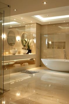 a bathroom with a large tub, sink and mirror on the wall next to it