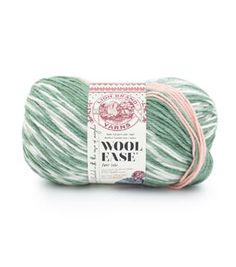 wool ease yarn in green and white, with pink trims on the end of it