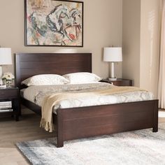 a bedroom with a bed, nightstands and painting on the wall above it's headboard