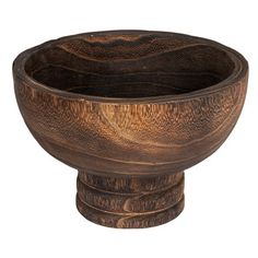 a wooden bowl sitting on top of a table