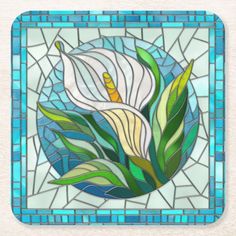 a stained glass flower with green leaves coasters