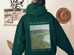 "Looking for the perfect gift for an art or Claude Monet lover? Welcome to Joy of Plants, where we offer a wide selection of unique products inspired by the renowned artist Claude Monet. 🌻 Our Monet Collection includes a variety of items such as Monet art prints on custom canvas totes, ceramic coffee mugs, comfy t-shirts, sweatshirts, hoodies and even personalized journals, wall art and phone cases. Each item features some of the most beautiful and iconic pieces of Monet's artwork, making them Claude Monet Clothes, Personalized Journals, Monet Inspired, Art Hoodie, Claude Monet Paintings, Claude Monet Art, Aesthetic Sweatshirt, Artsy Aesthetic, Canvas Totes