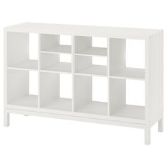 a white bookcase with multiple compartments on each side