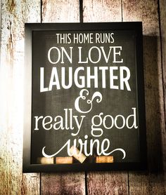 this home runs on love, laughter and really good wine hand painted sign with corks