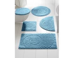 four bathroom rugs in various shapes and sizes