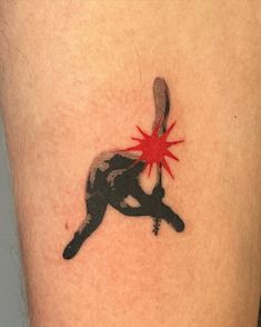 a tattoo on the leg of a person with a red star in their hand,