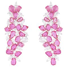 Immerse yourself in the breathtaking allure of our 18 Karat Gold 21.6 Carat Pink Sapphire & Diamond Chandelier Earrings, where sophistication meets extravagance in a symphony of shimmering gemstones and exquisite design. Each pair is meticulously crafted and uniquely curated, promising a timeless expression of luxury and refinement. These stunning chandelier earrings feature a dazzling array of 21.6 carats of pink sapphires, elegantly complemented by radiant diamonds. The soft pink hue of the sa Stunning Chandelier, Diamond Chandelier Earrings, Diamond Chandelier, Radiant Diamond, Crown Jewels, Gorgeous Jewelry, Belleza Natural, Sapphire Diamond, Exquisite Design