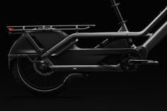 an electric bike is shown on a black background