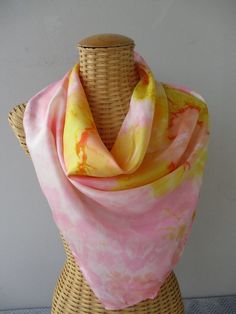 Silk scarf, hand painted. The colors used, golden yellow, pink and coral, blend or clash, depending on your mood. This unique creation will appeal to refined women. Very easy to maintain (care instructions provided), it will enhance your outfit. Hand rolled hem. Dimensions of the scarf: 90cmX90cm This scarf can be made in other colors, (manufacturing time 15 days) do not hesitate to contact me so that we can finalize your project Packaged with care, this item comes with gift packaging. Shipping Pink Hand-dyed Scarf, Yellow Silk Scarf For Spring Gift, Artistic Pink Silk Scarf, Pink Hand Painted Silk Scarves, Handmade Pink Silk Scarves, Artistic Pink Silk Scarf For Summer, Pink Artistic Scarf For Spring, Spring Yellow Scarves, Pink Artistic Scarves For Summer