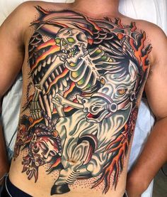 a man with a skeleton tattoo on his back