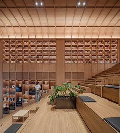 an empty library with bookshelves and plants