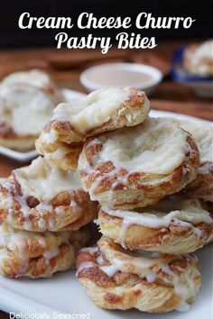 cream cheese churro pastry bites are stacked on a white plate with the title above it