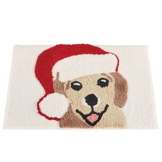 a dog with a santa hat on it's head is shown in this bathroom rug