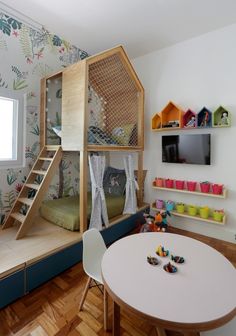 a child's room with a bunk bed and play area in the corner, next to a window