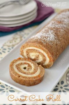 carrot cake roll on a white plate with the words crazy for crust written below it