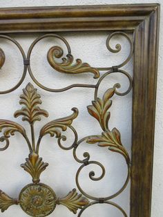 an ornate metal frame on the wall