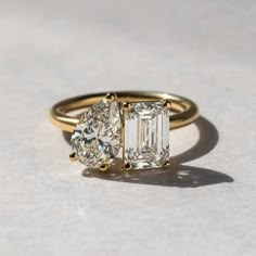 an engagement ring with three stone diamonds on it