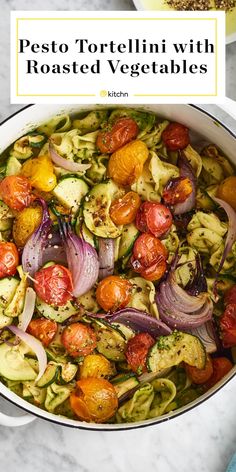 pesto tortellini with roasted vegetables in a white pot on a marble countertop