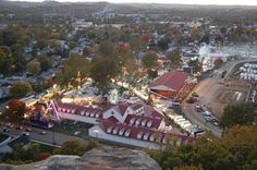 an aerial view of a fairground at dusk