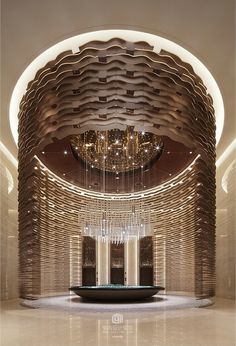 a large room with a chandelier hanging from it's ceiling and two tables in the center