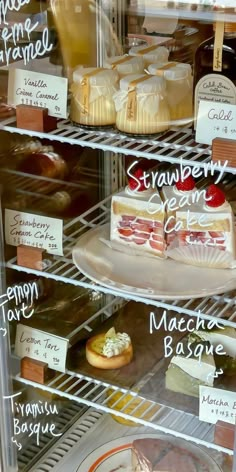 a display case filled with different types of desserts