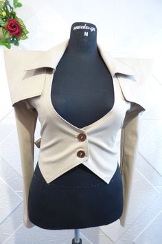 Non-standard women's jacket in beige color with additional parts. the model can be made in other colors. Available sizes - IZE-EU-XXS-34 Bust-78cm.-80cm. Waist-58cm.-62cm. Hips - 84cm.-88cm. SIZE-USA-0 Bust -30.50in.-31in. Waist- 22.50in.-24in. Hips-33in.-34.50in. --------------------------------------------------- ------------------------------------ SIZE-EU-XS-36 Bust-81cm.-85cm. Waist-64cm.-67cm. Hips -88cm.-91cm. SIZE-USA-2 Bust-32in.-33.50in. Waist -25in.-26in. Hips-34.50in.-35.50in ------- Fitted Single Breasted Beige Outerwear, Fitted Khaki Cropped Jacket For Winter, Winter Fitted Khaki Blazer, Fitted Beige Office Top, Winter Khaki Fitted Blazer, Fitted Beige Top For Office, Beige Single Breasted Cropped Jacket For Fall, Fall Beige Single Breasted Cropped Jacket, Khaki Fitted Outerwear With Lapel Collar