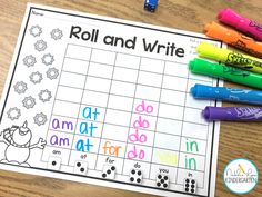 a roll and write game with crayons on the table