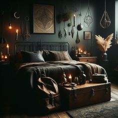 a bedroom with dark walls and lots of candles