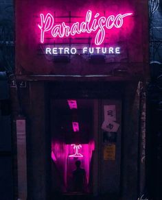 a neon sign that reads paradisco retro future