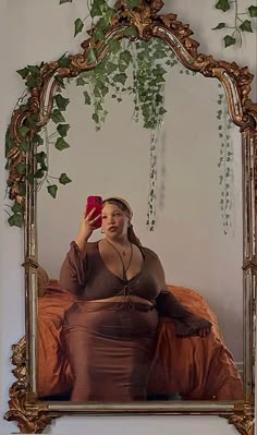 Plus size biracial girl sitting on bed in a long brown skirt with head scarf on taking a picture in gold ornate mirror Black Women Soft Aesthetic, Black Earth Girl Aesthetic, Black Spiritual Aesthetic, Spiritual Black Women, Black Earthy Aesthetic, Black Earthy Girl, Blackgirl Aesthetics, Hippie Black Woman, Spiritual Baddie Outfits