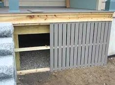 the outside of a house that has been built with wood and metal siding on it