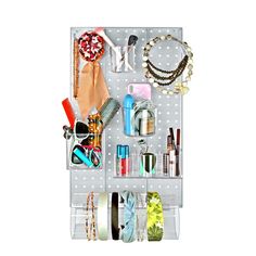 a white polka dot wall hanging organizer with bracelets, necklaces and other items