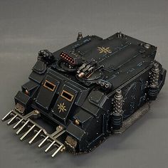 a toy model of a warhammer with spikes on it