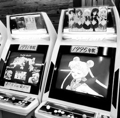 three arcade machines with cartoon characters on them